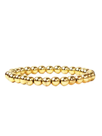 Shiny gold-colored bracelet formed by many uniform round beads.