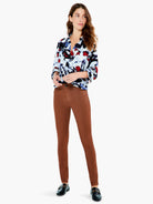Rust brown, slim-fit ankle pants.