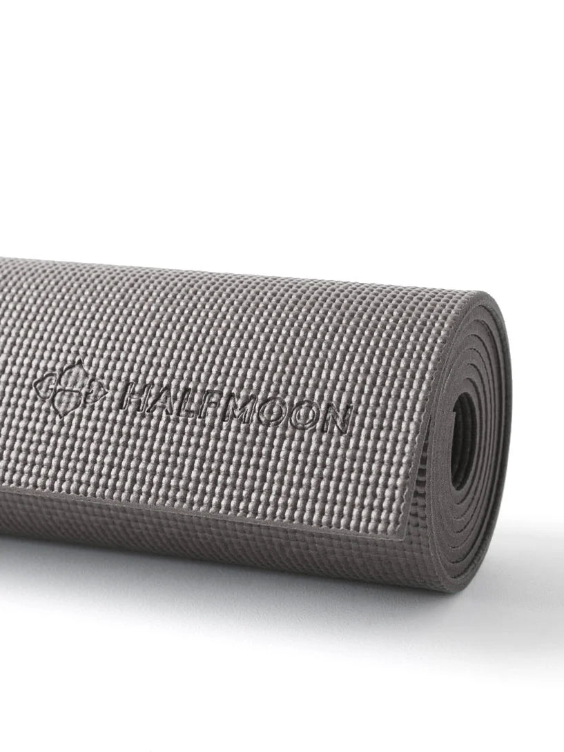 Rolled dark gray yoga mat with a dimpled surface texture and an embossed 'HALFMOON' logo.