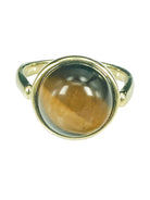Gold ring with a round brown and gold Tiger's Eye stone.