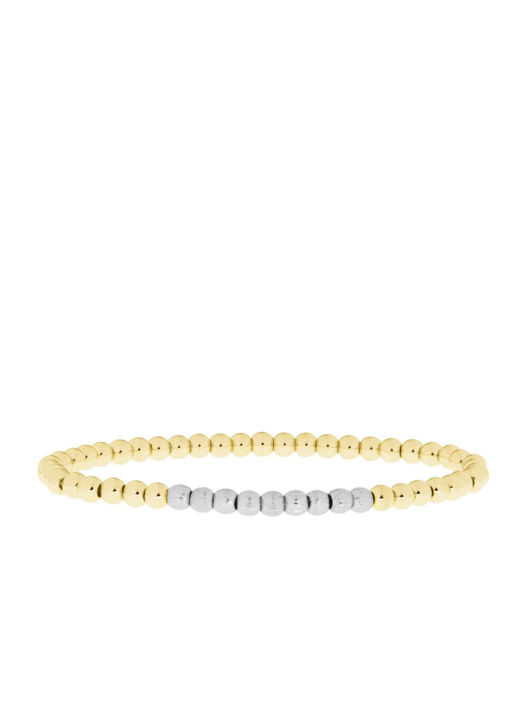 Bracelet with smooth gold beads and a central section of textured silver beads.