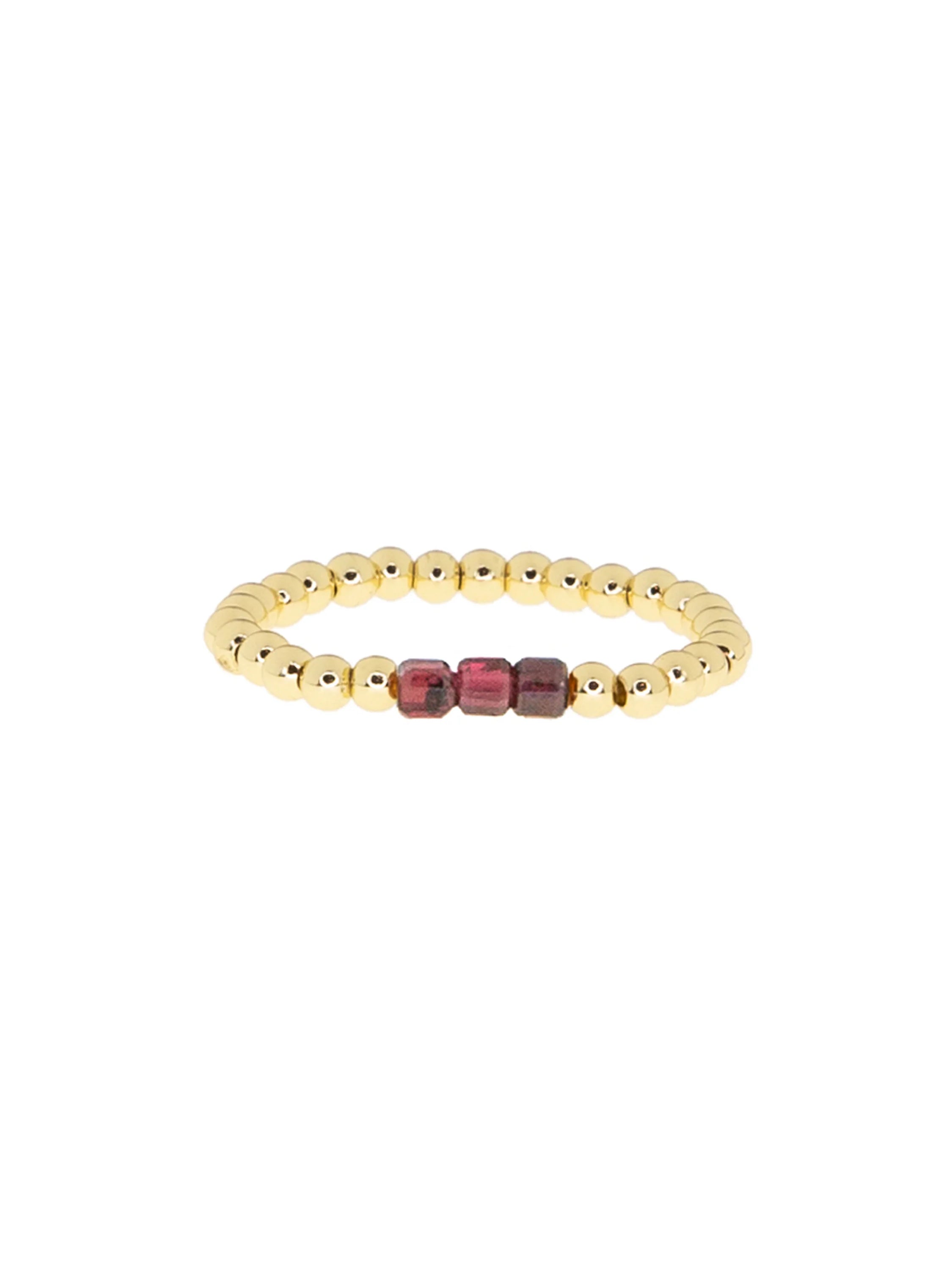 Gold beaded ring with three central dark red rectangular glass beads.