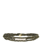 Multi-strand dark olive green faceted bracelet with an irregular off-white pearl and gold accent.