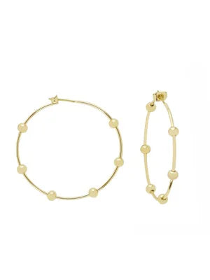 Two gold hoop earrings with small, round gold beads spaced along the hoops. One large earring, one smaller.