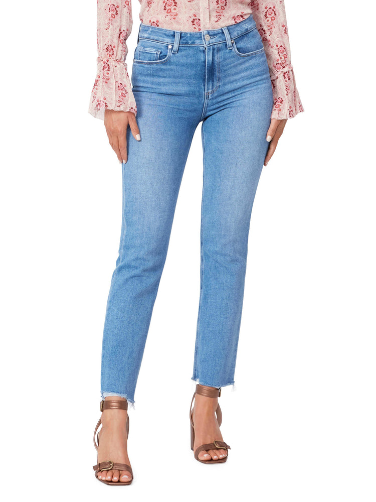 Light blue, straight-leg jeans with a raw hem. Model is wearing rose gold heels.