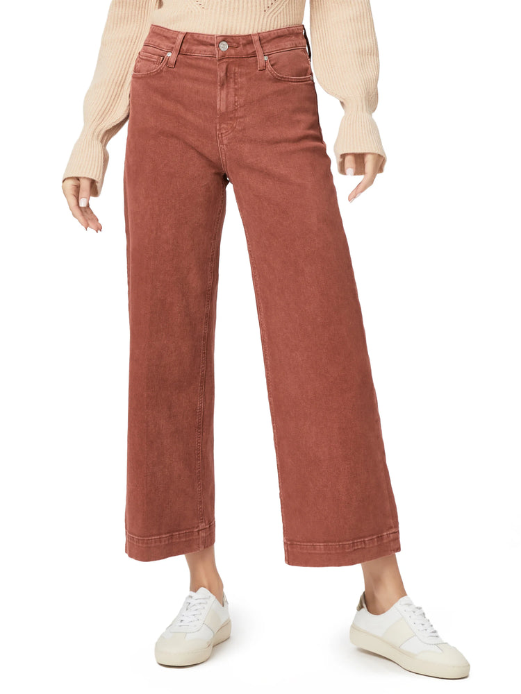 Rust high-waisted wide leg cropped jeans with visible denim texture.