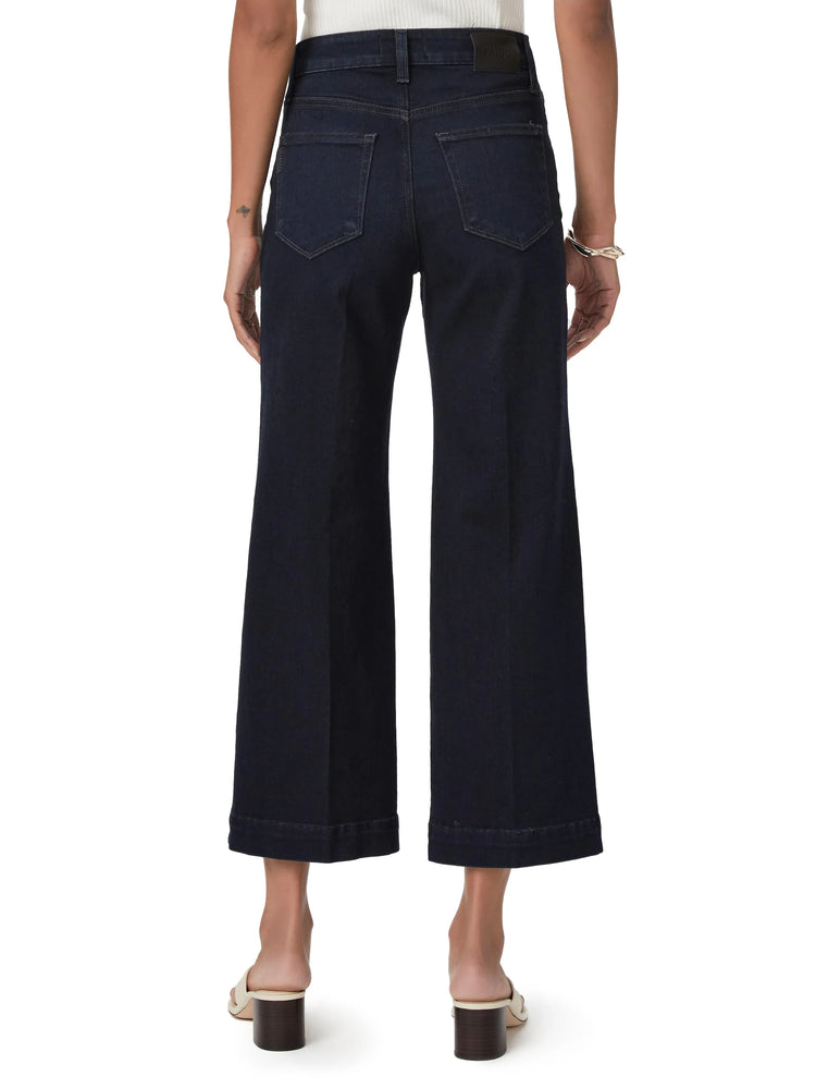 Dark wash, wide-leg cropped jeans; back view.