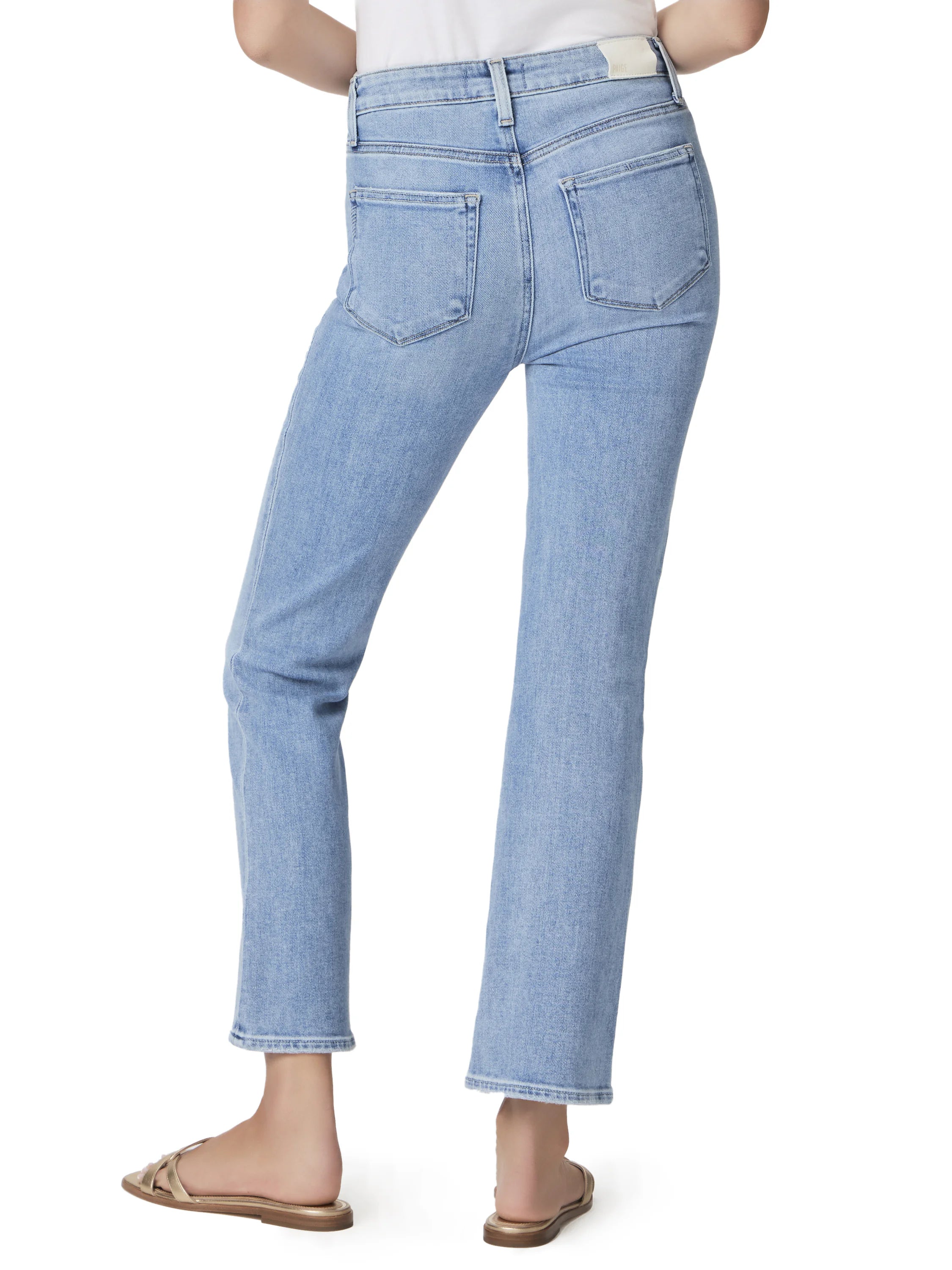 Light wash, ankle-flare jeans; back view. Features two back pockets.