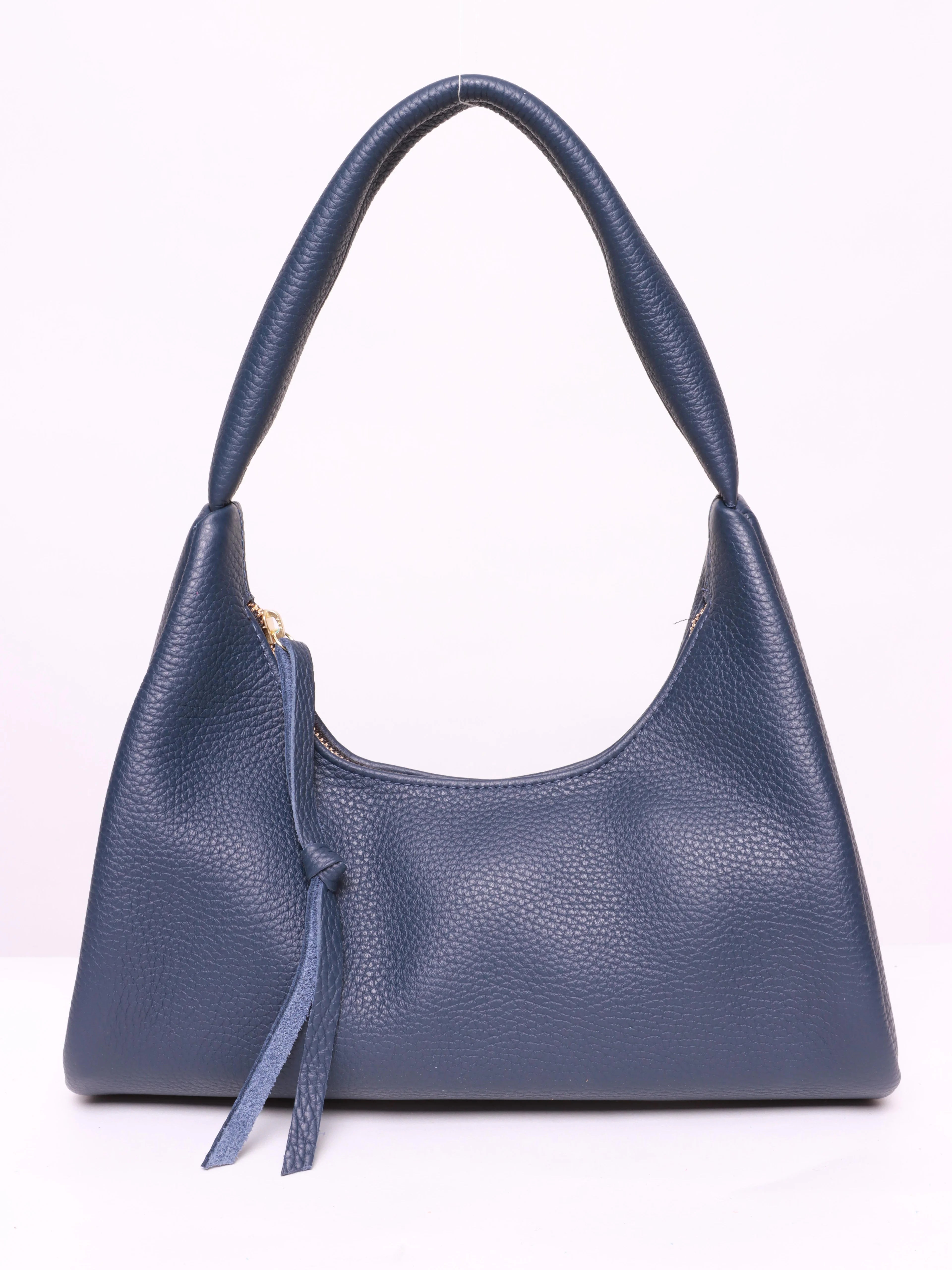 Dark blue textured leather baguette bag with top handles and a small zipper pull.