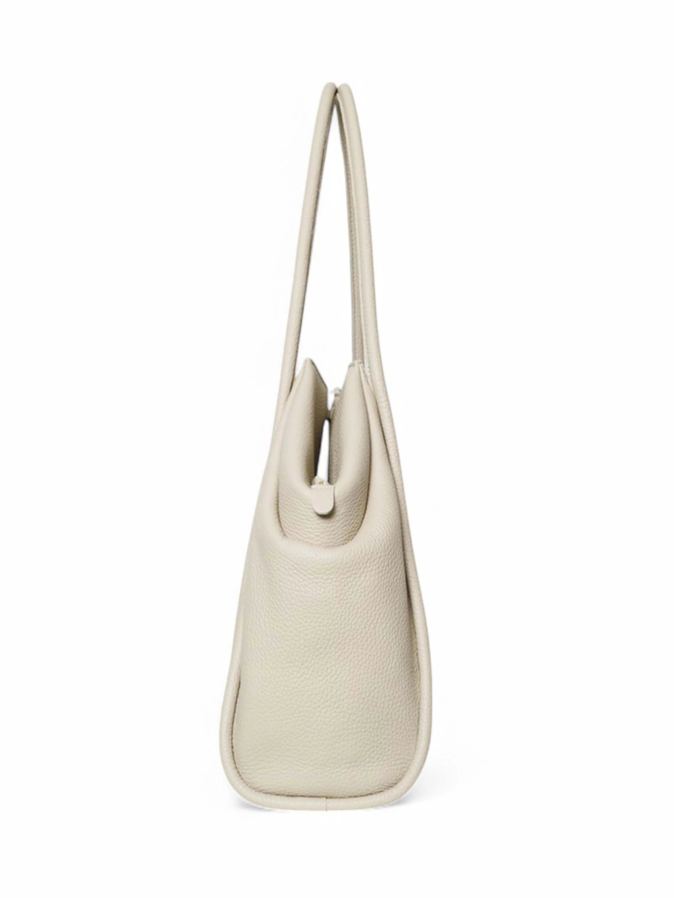Off-white tote bag with two top handles and a zipper closure. Textured pebbled leather.