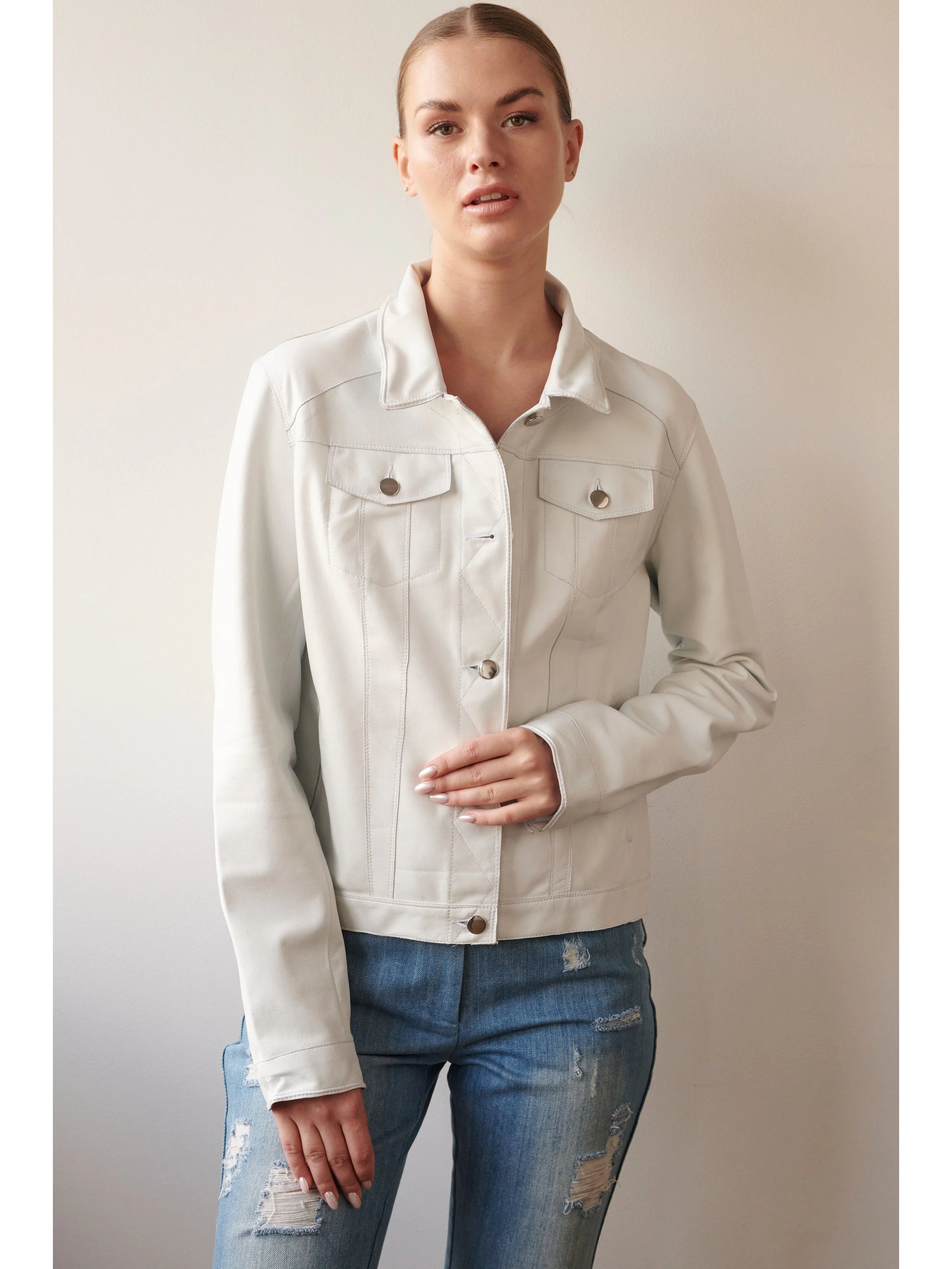Off-white leather jacket, button front, two chest pockets, long sleeves. Silver buttons.