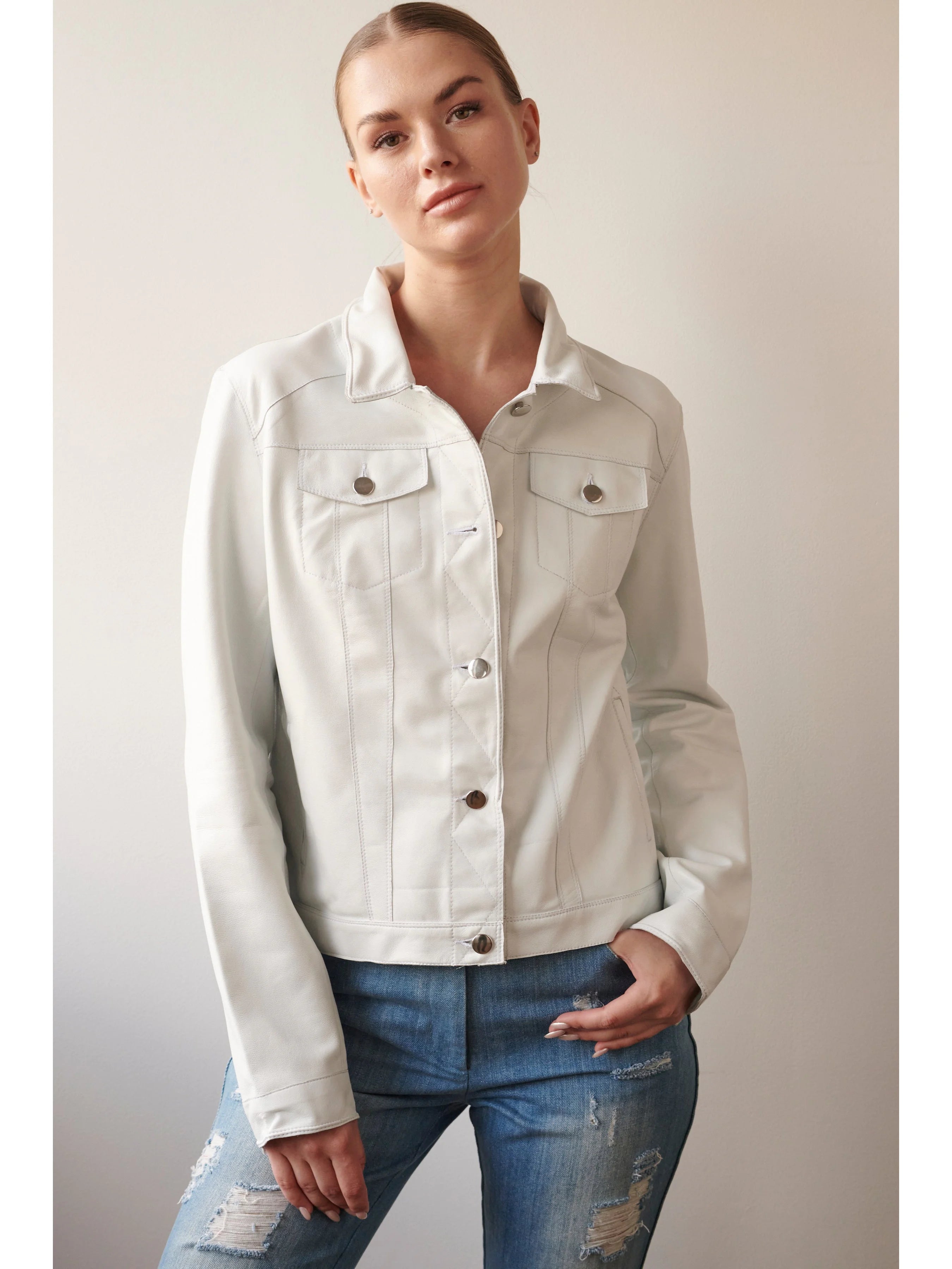 Off-white leather jacket, button front, two chest pockets, long sleeves. Silver buttons.