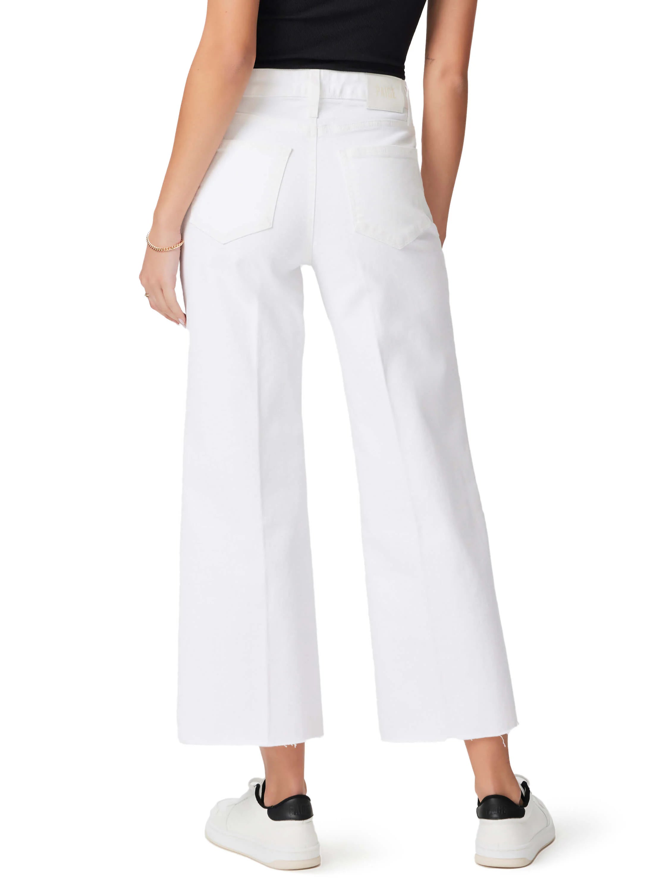 White cropped straight-leg jeans with a frayed raw hem, shown from behind. Back pockets visible.