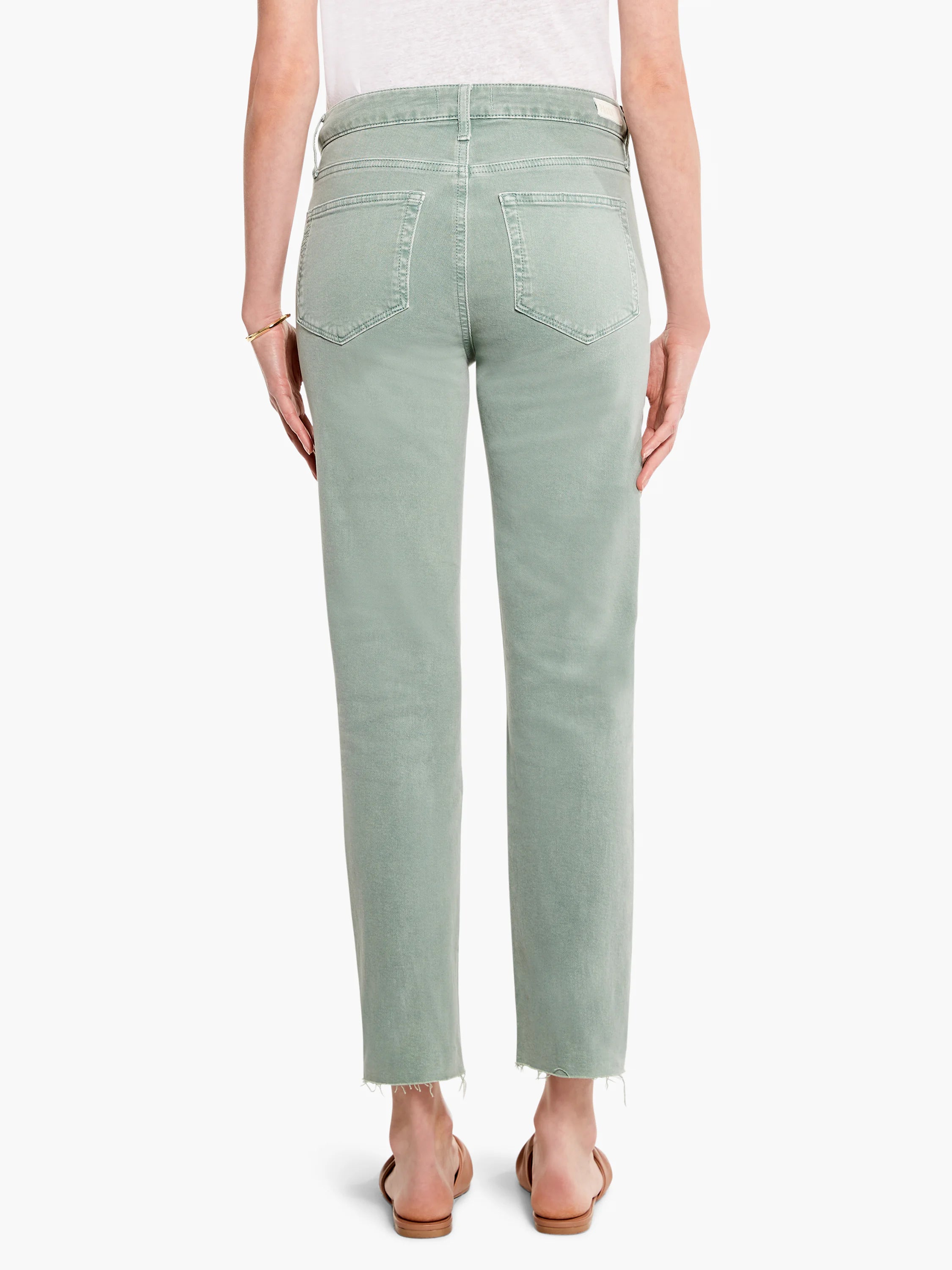 Faded green straight leg jeans with back patch pockets and a raw, frayed hem.