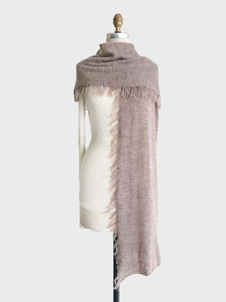 Long taupe alpaca scarf with frayed edges; shown draped over a white mannequin.