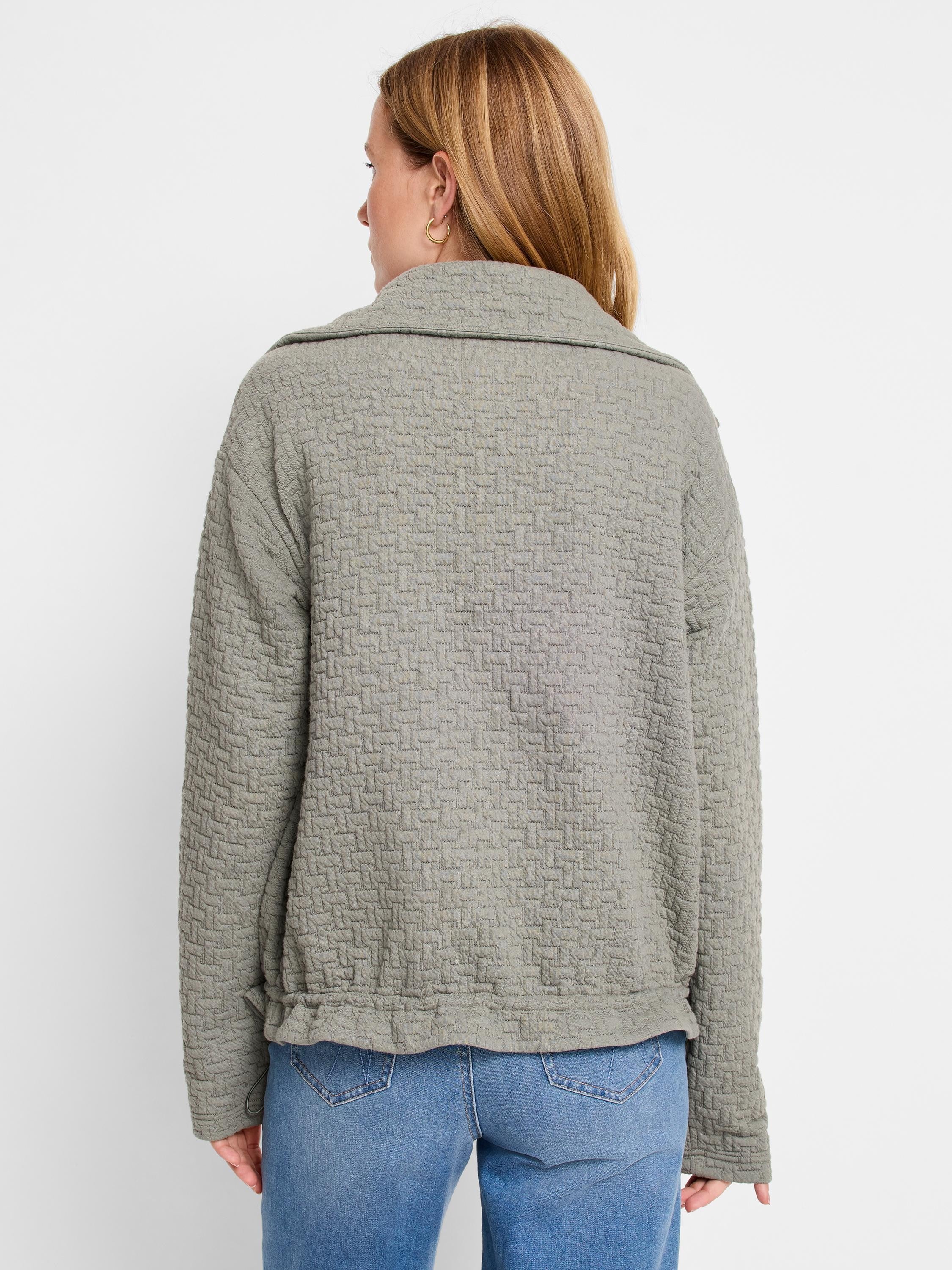 Sage green quilted jacket, textured weave. Long sleeves, collared. Shown from the back.
