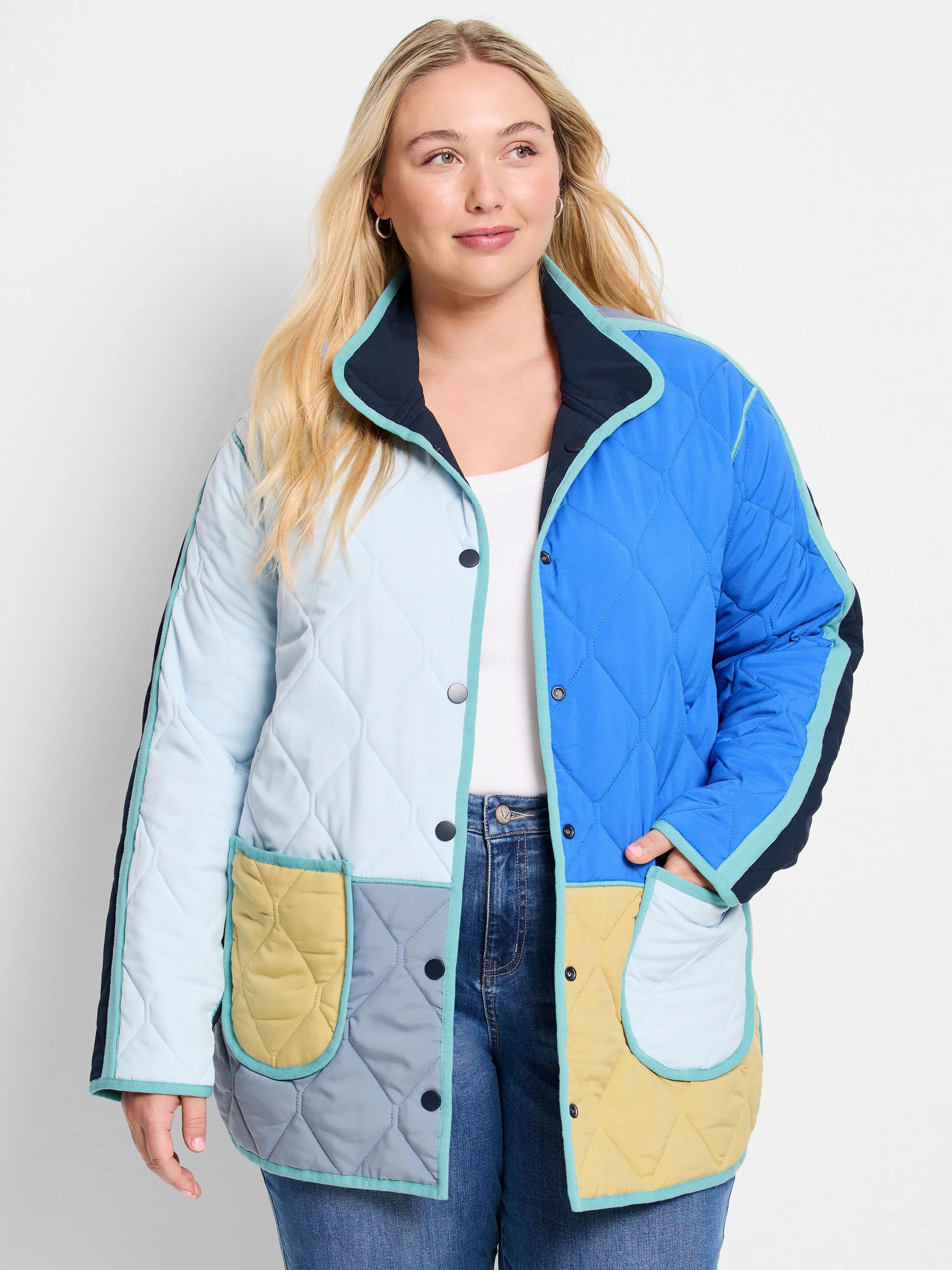 Quilted color-block coat with light/royal blue, yellow, grey panels, teal trim, snap buttons, & patch pockets.
