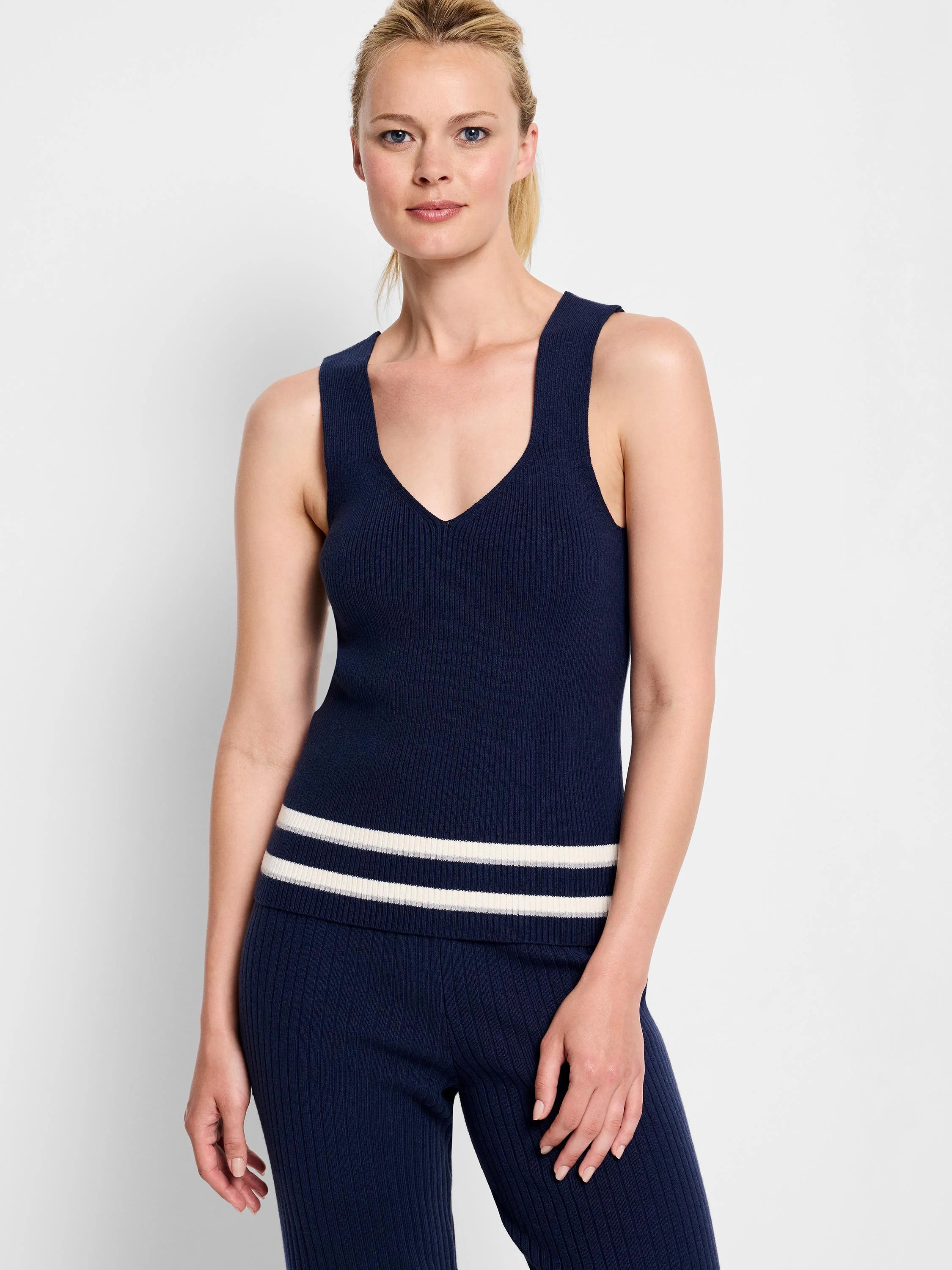 Navy blue ribbed knit tank top with a V-neck and two thin off-white stripes near the hem.