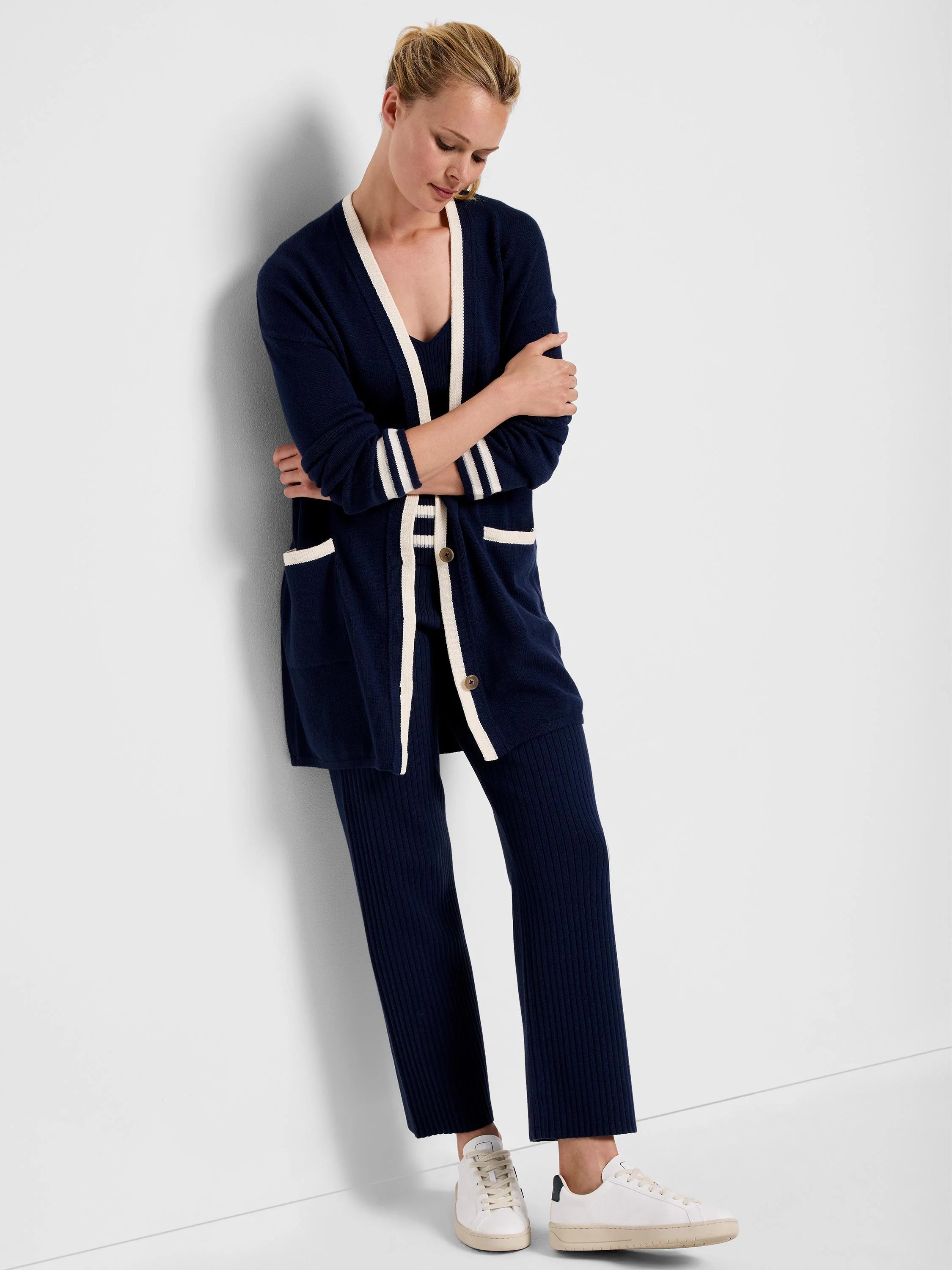 Navy blue sweater tank and pants set with off-white trim. The sweater has pockets.