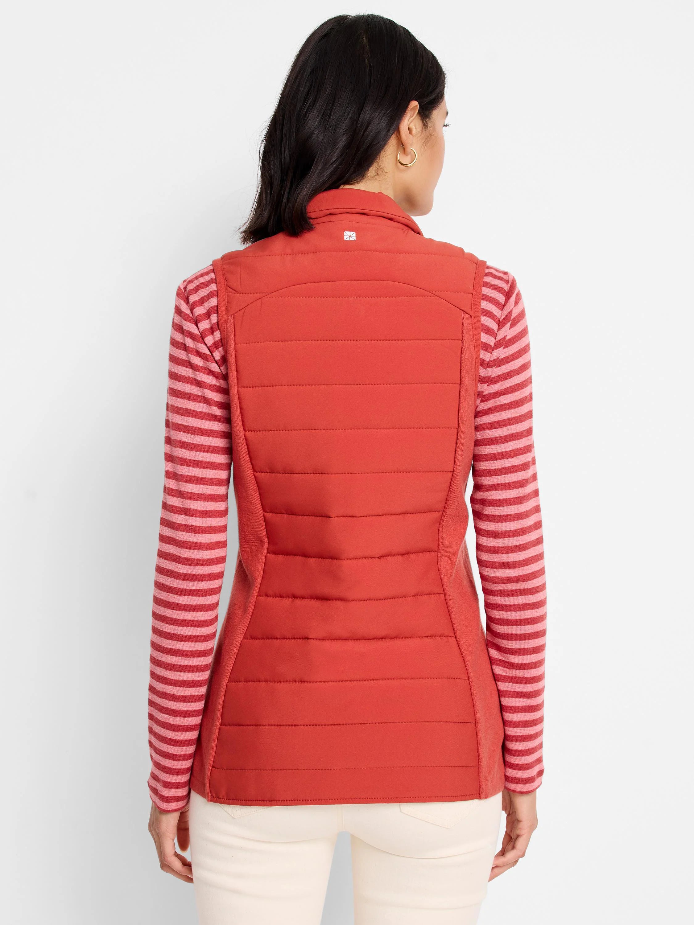 Red quilted puffer vest, horizontal lines, knit trim. Back view.