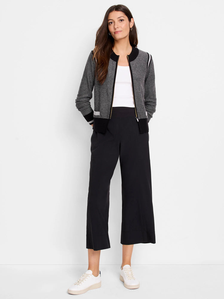 Gray zip-front cardigan with black and white stripes at the cuffs and hem. Gold zipper.