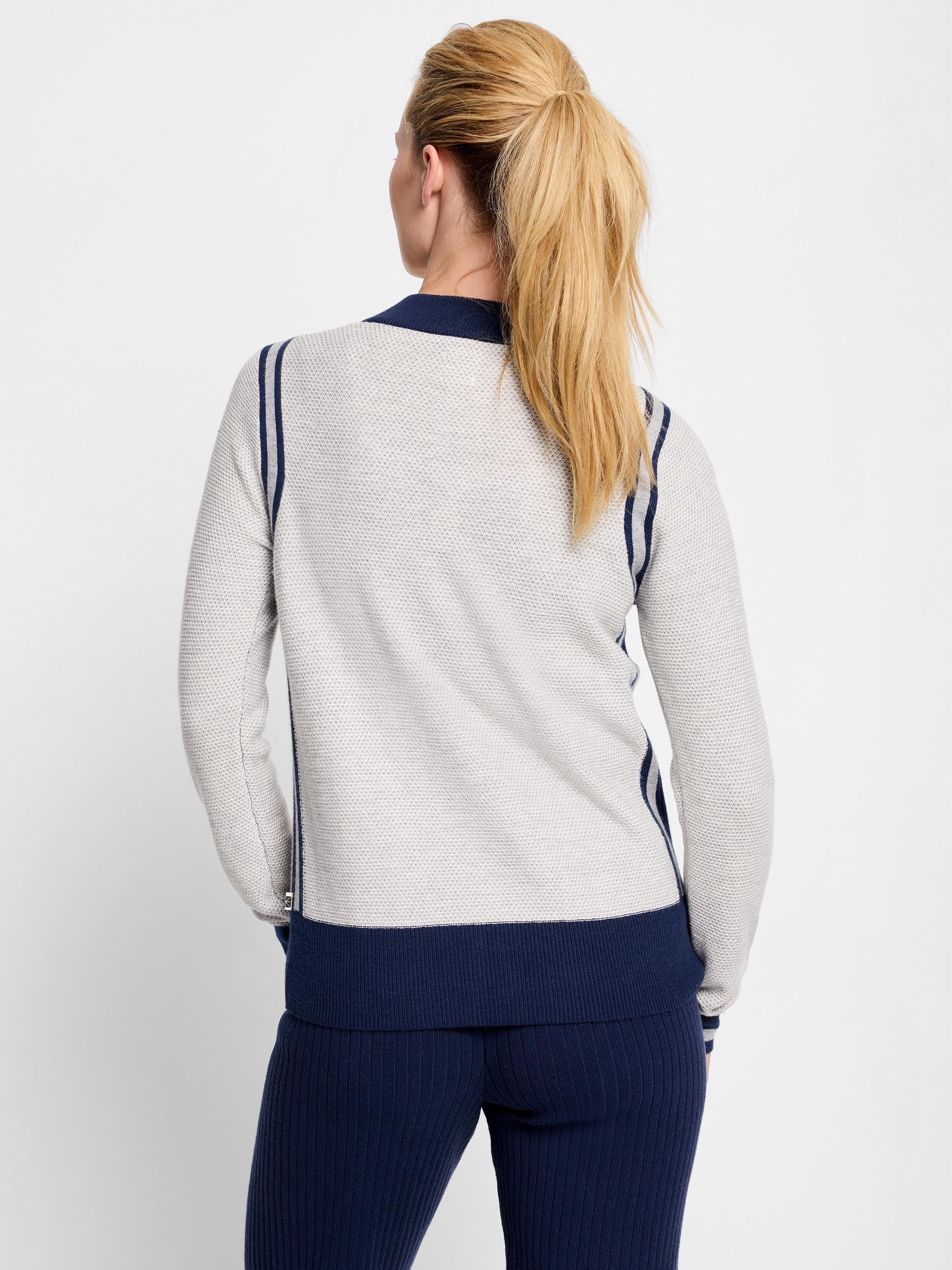 Here's alt text that meets the requirements:
Gray zip-front cardigan with navy blue stripes and trim.