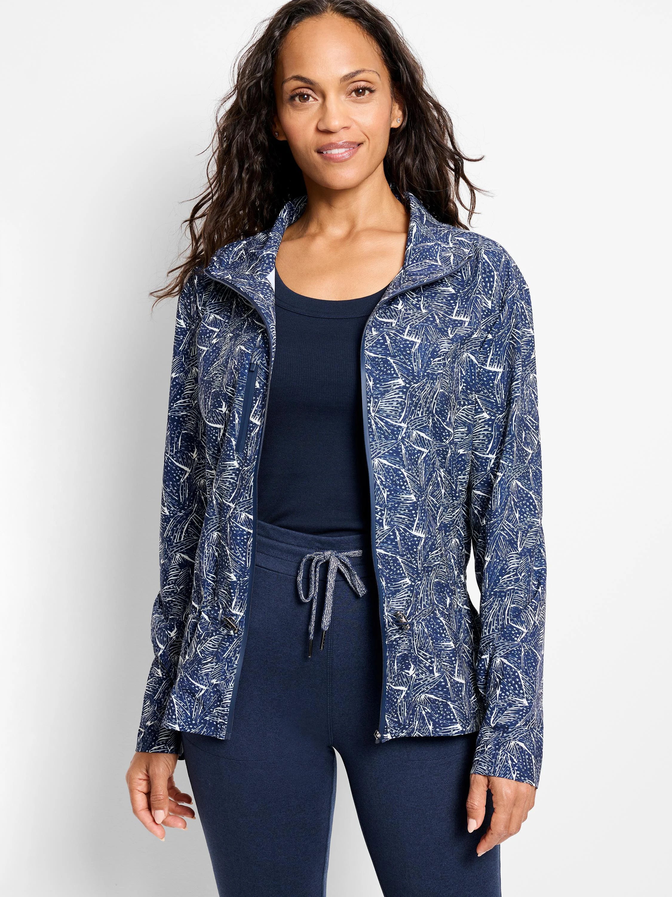 Navy blue zip-front jacket with white abstract print. Long sleeves.