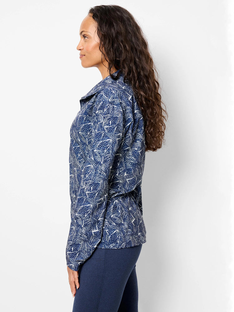 Navy blue zip-front jacket with a white abstract print. Long sleeves.