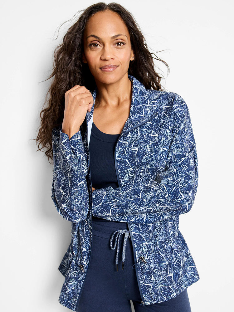 Navy blue zip-front jacket with white abstract leaf pattern. Long sleeves.