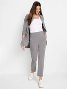 Gray long-sleeve Tech Stretch shirt with collar and button-down front. Shown unbuttoned over a white tank top.