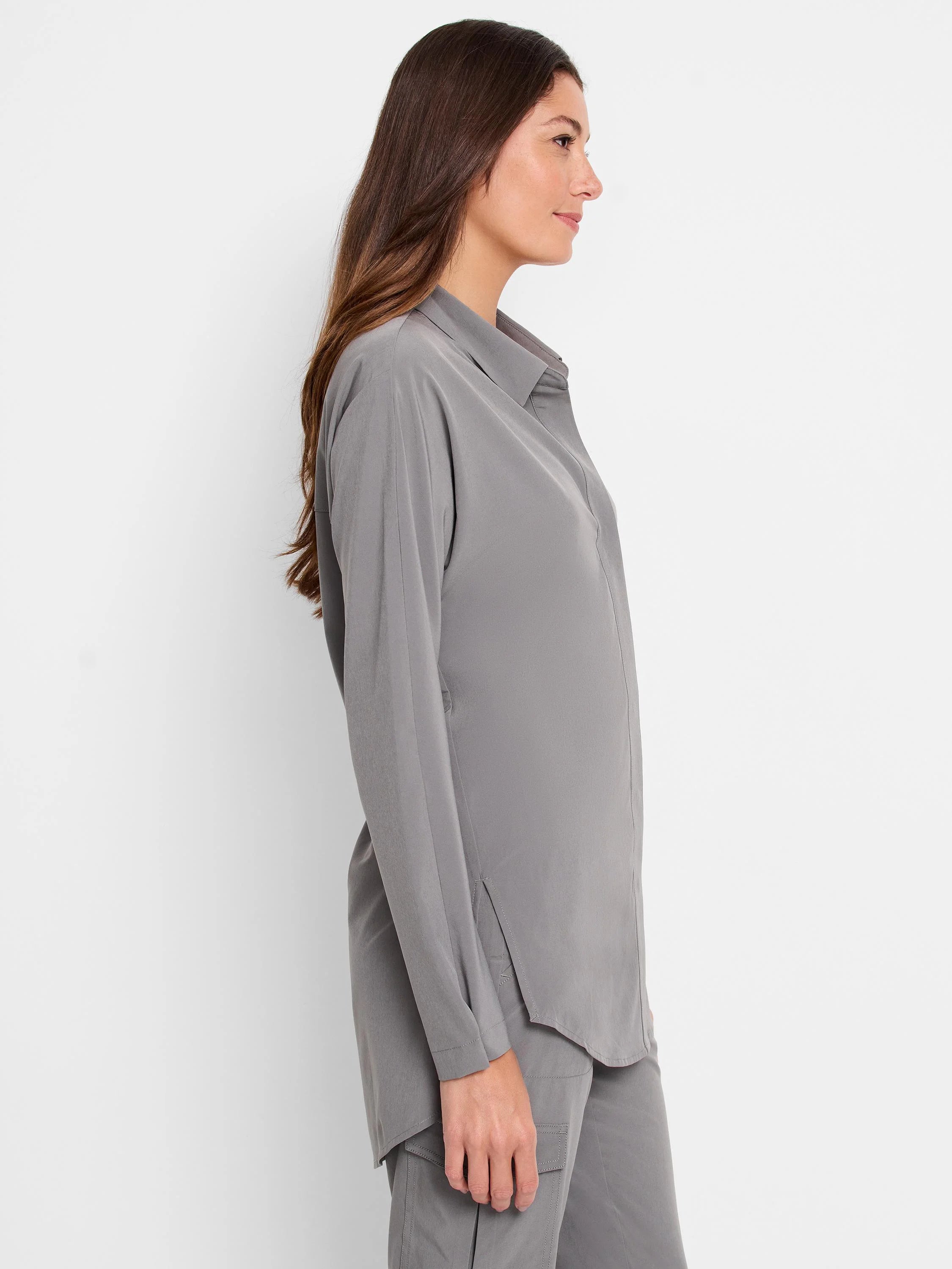 Grey long-sleeved collared shirt with a loose fit and side slits.