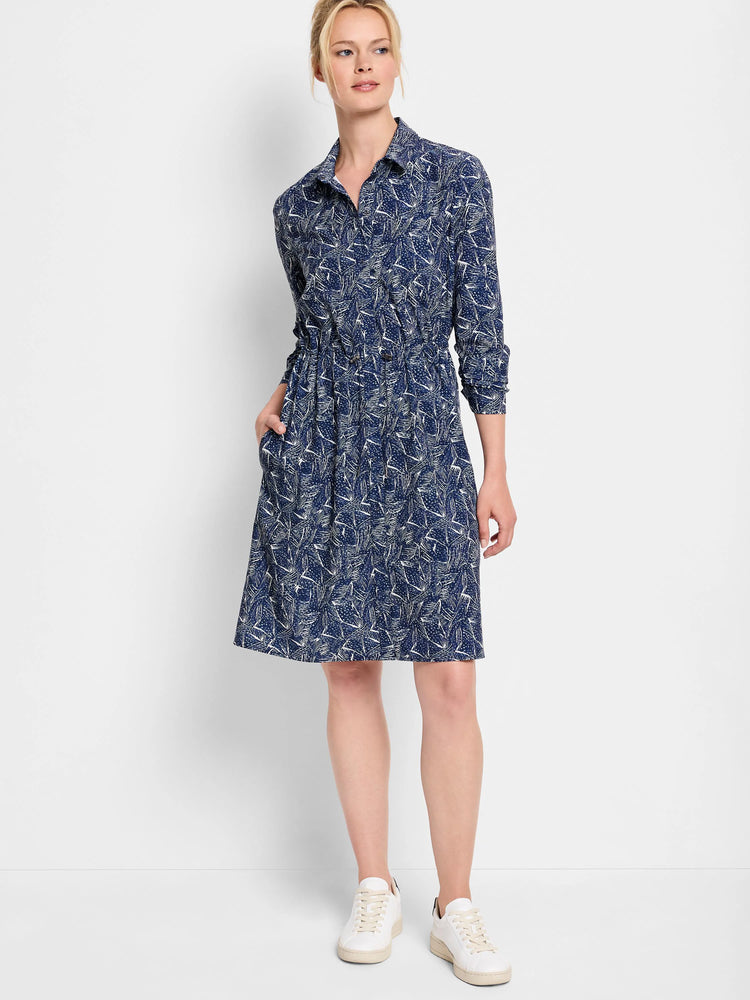 Navy blue dress with a white abstract print, collared, long sleeves, knee-length, cinched waist, and pockets.