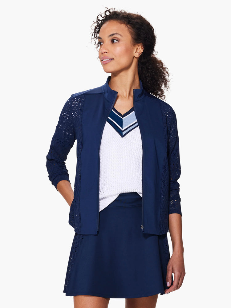 Navy blue jacket with lace-like cutouts on sleeves and sides. Long sleeves, zip front.