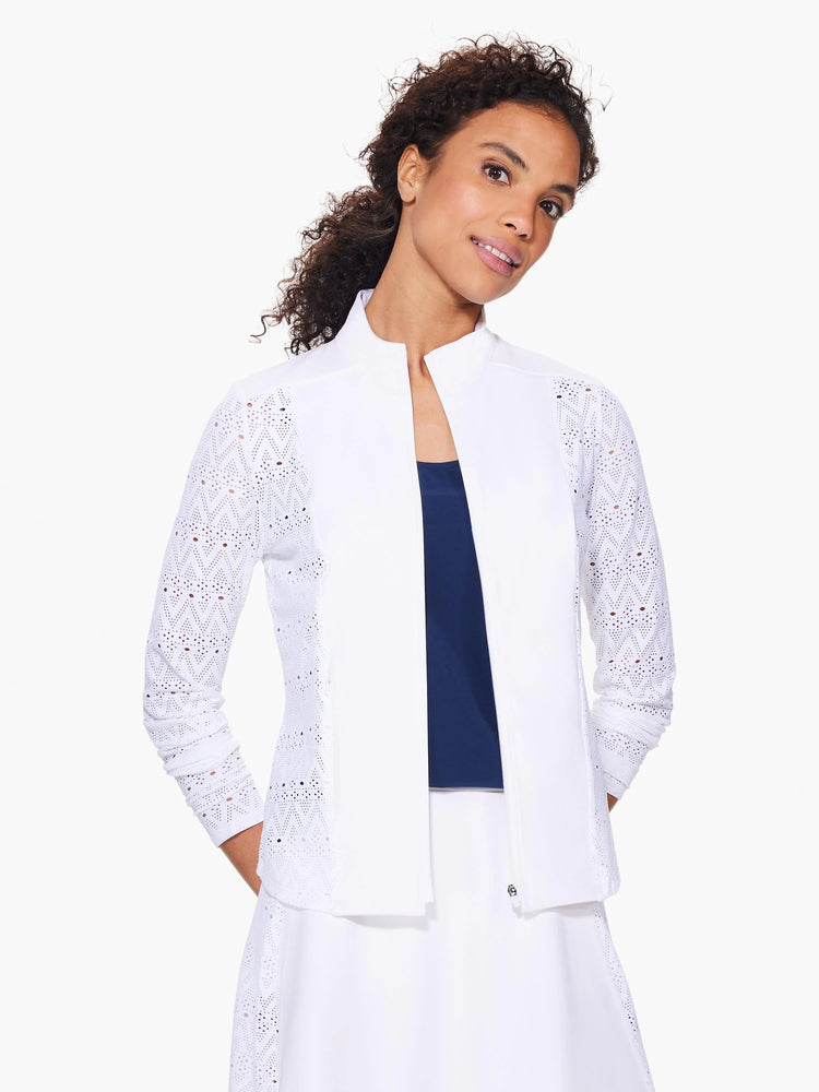 White zip-up jacket with long sleeves. Lace-like pattern on sleeves and hem. Subtle texture.