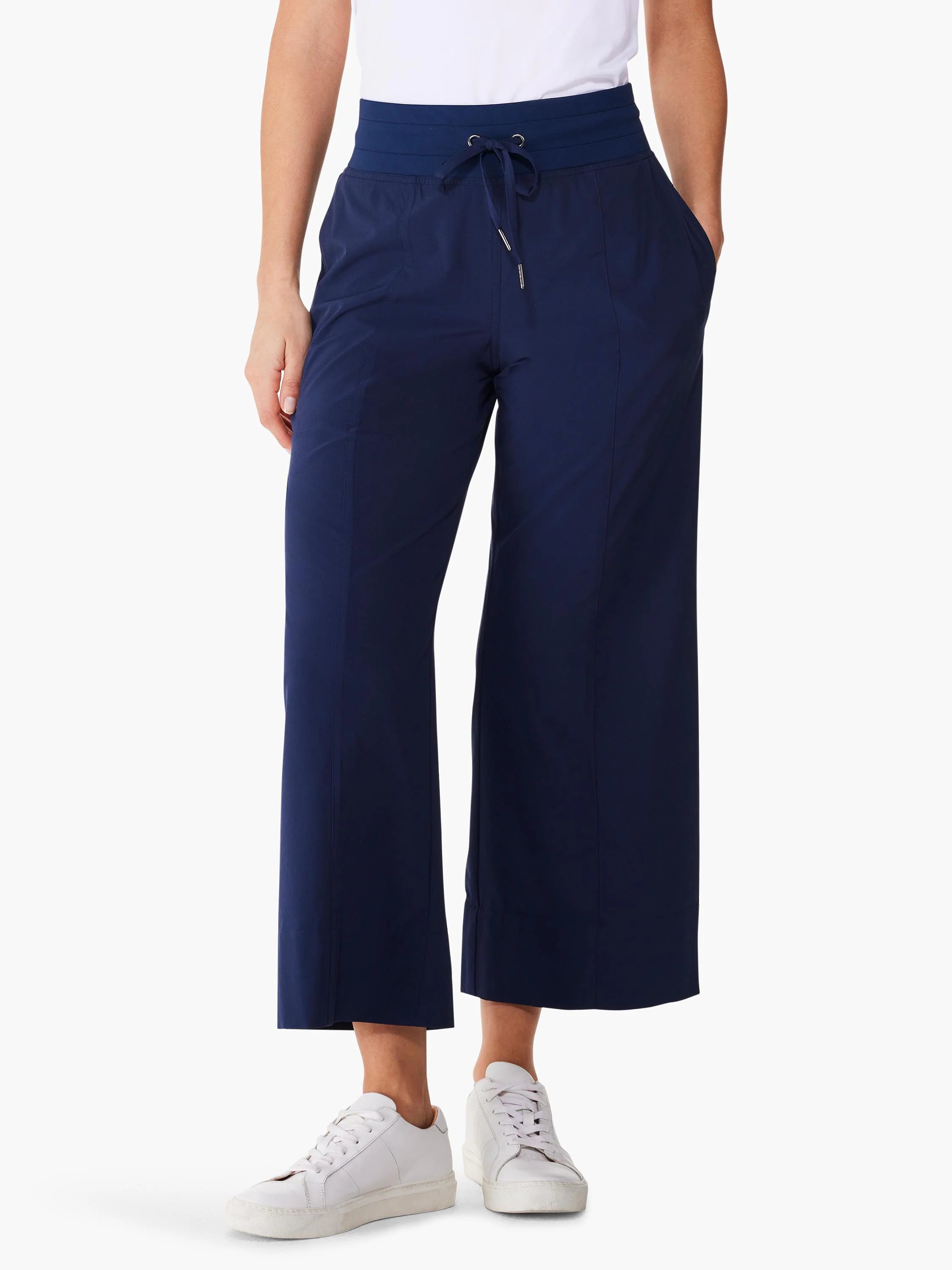 Navy blue wide-leg cropped pants with elastic waistband and drawstring. Features pockets.