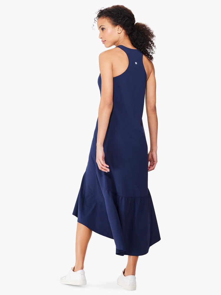 Navy blue sleeveless maxi dress with a high-low hemline and subtle ruffle detail. Back view.