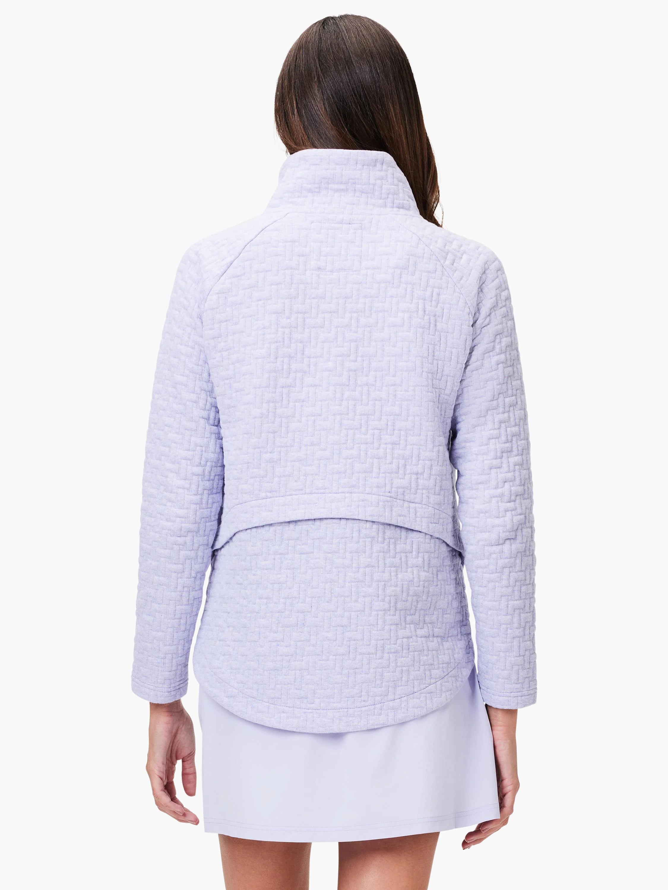 Lilac quilted jacket, long sleeves, mock neck. Textured woven pattern. Shown from the back.