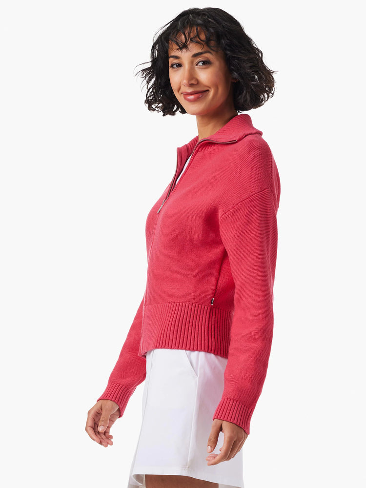Pink zip-front sweater jacket; ribbed cuffs and hem. Cropped length.