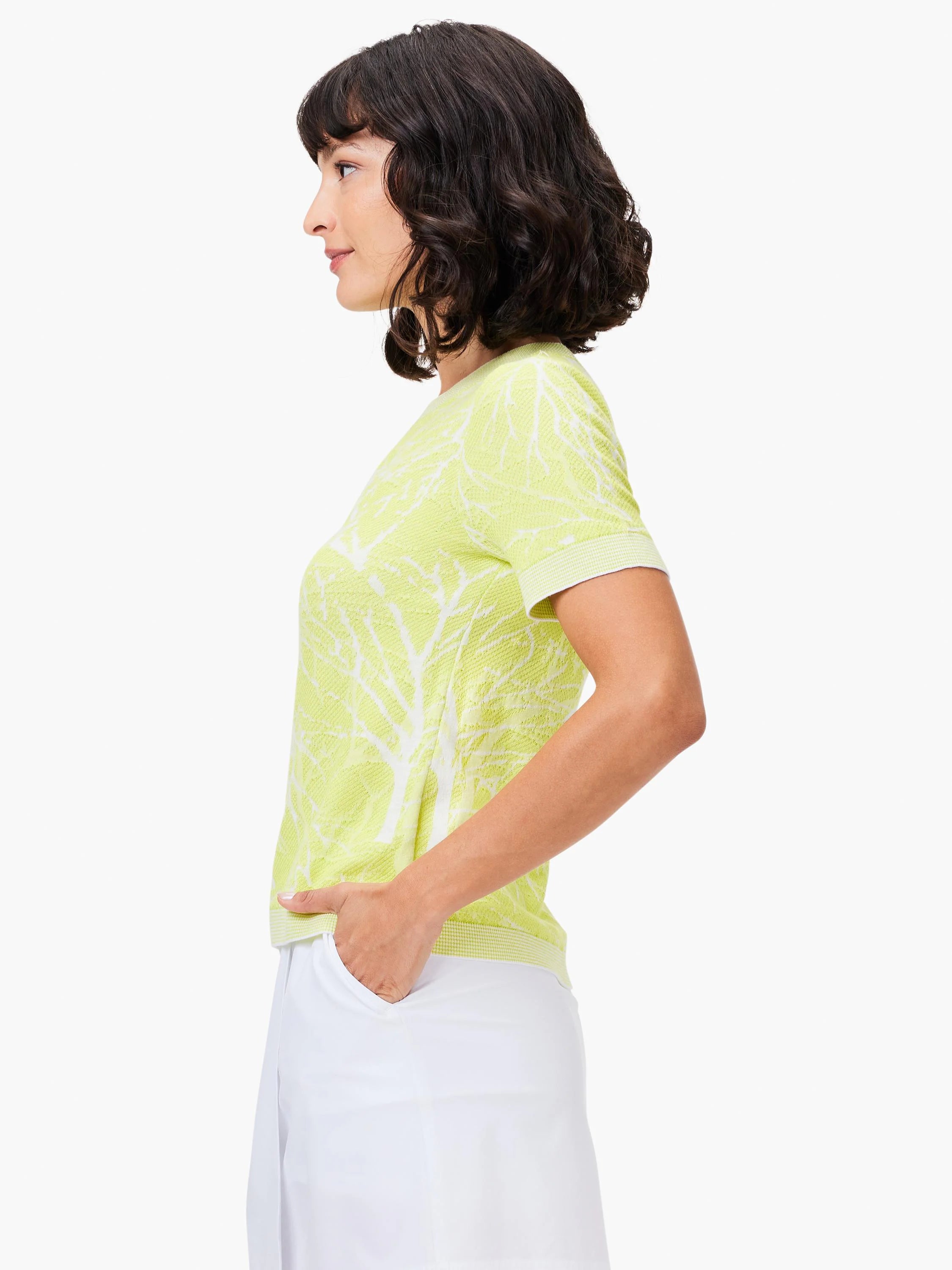 Lime green short-sleeve sweater tee with white tree branch pattern. Crew neck.