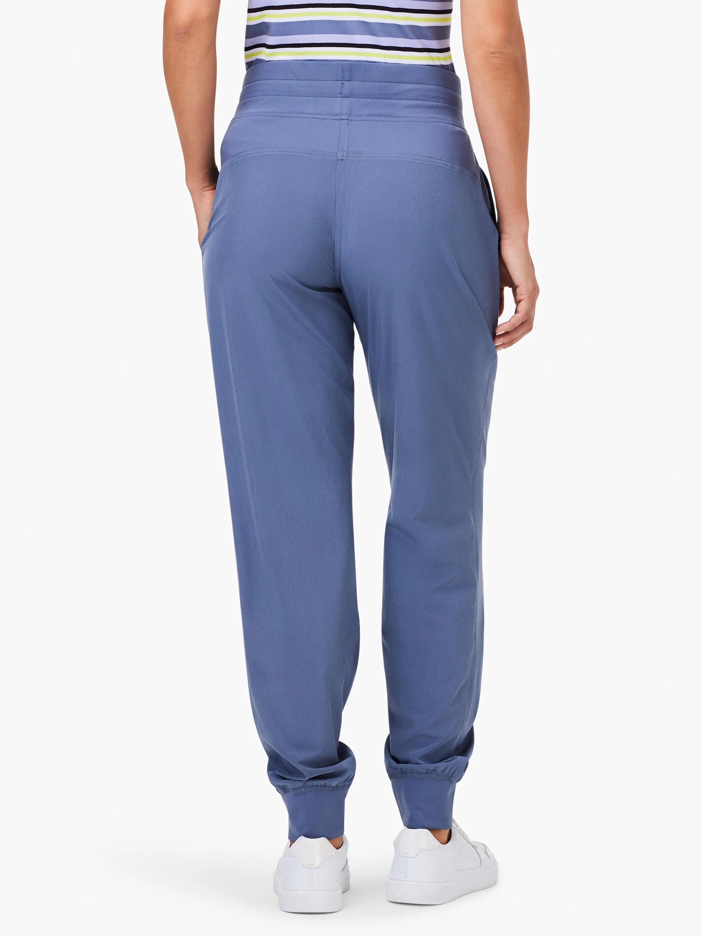 Periwinkle blue joggers, rear view. Features ruched elastic ankle cuffs, a gathered waistband, and side pockets.