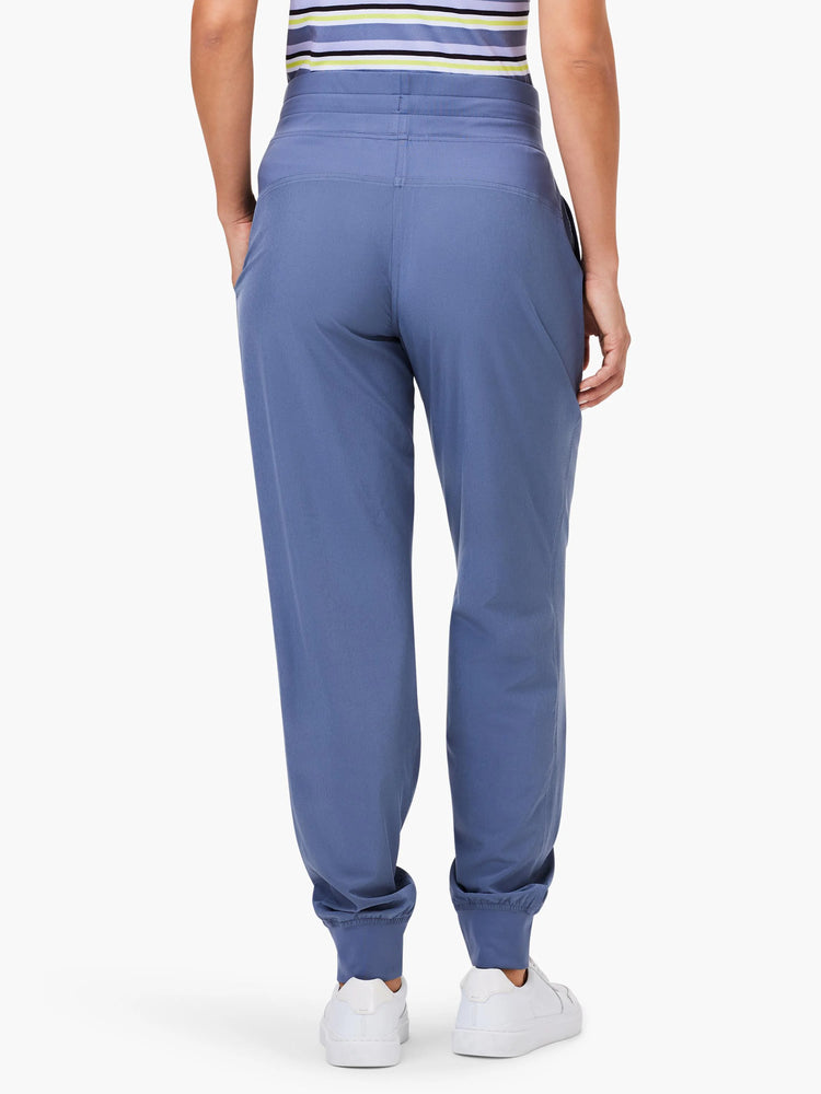Periwinkle blue joggers, rear view. Features ruched elastic ankle cuffs, a gathered waistband, and side pockets.