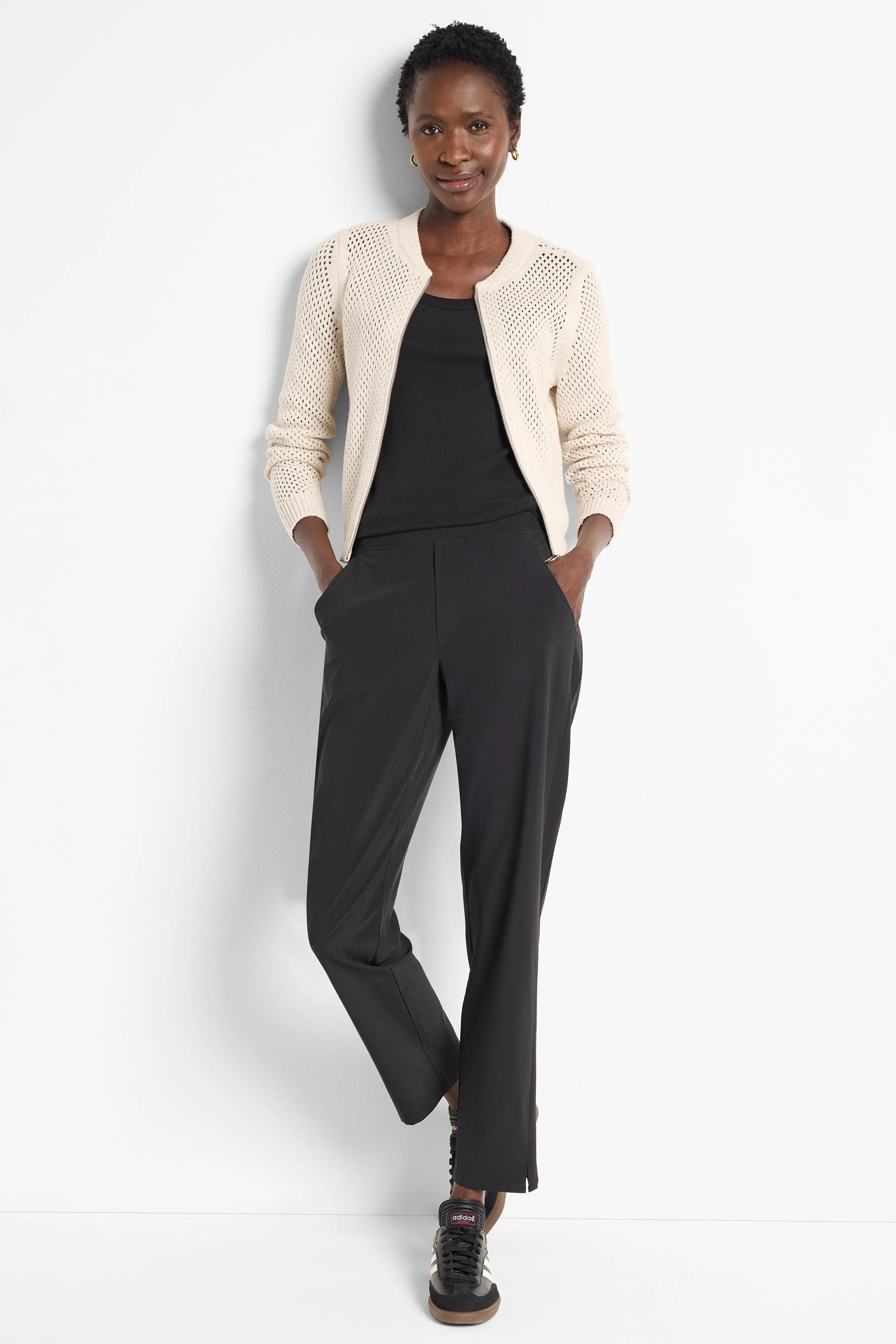 Off-white zip-front mesh cardigan. The mesh pattern is visible.