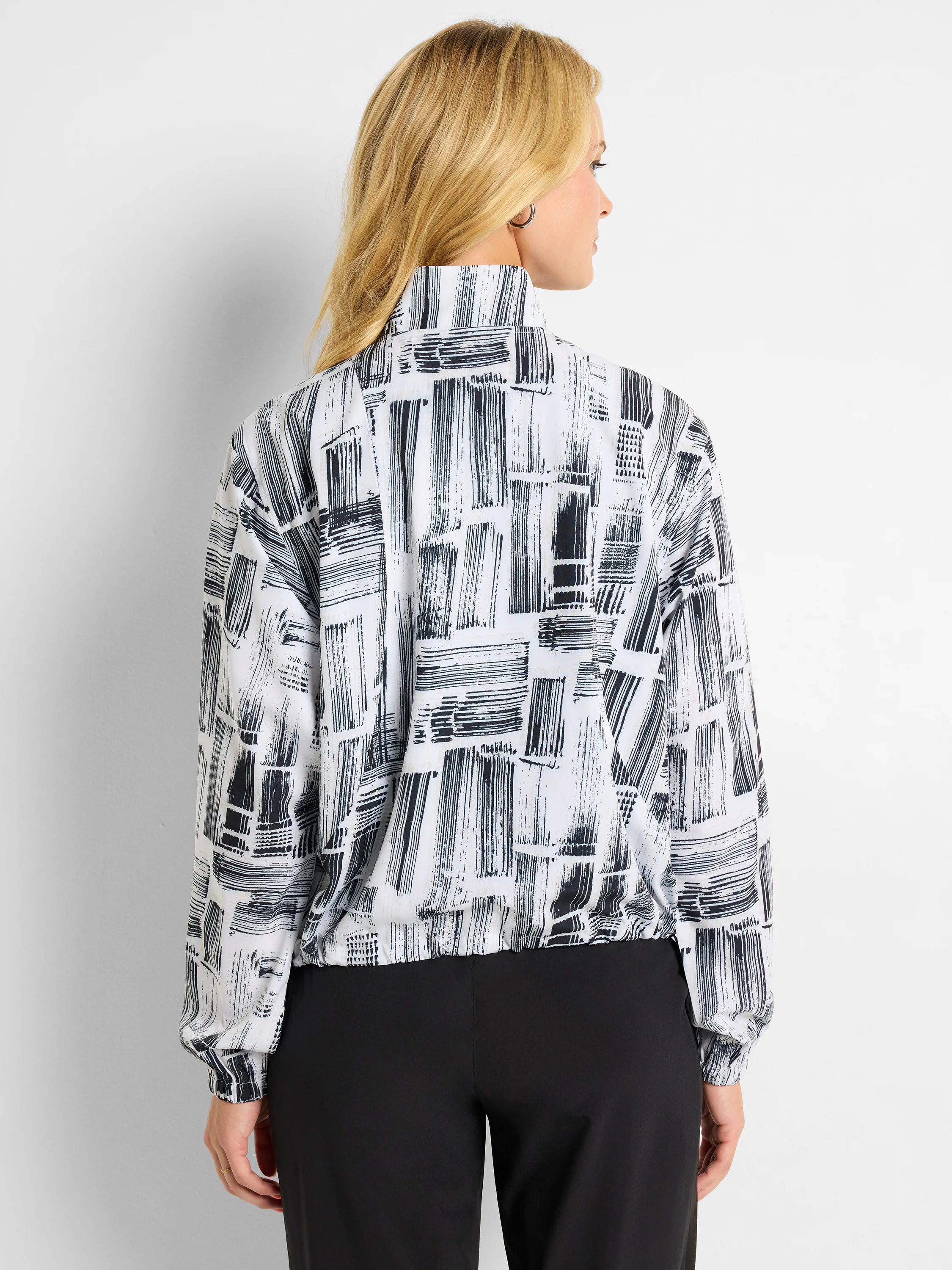 White popover with black abstract brushstroke pattern. Long sleeves, banded cuffs and hem.