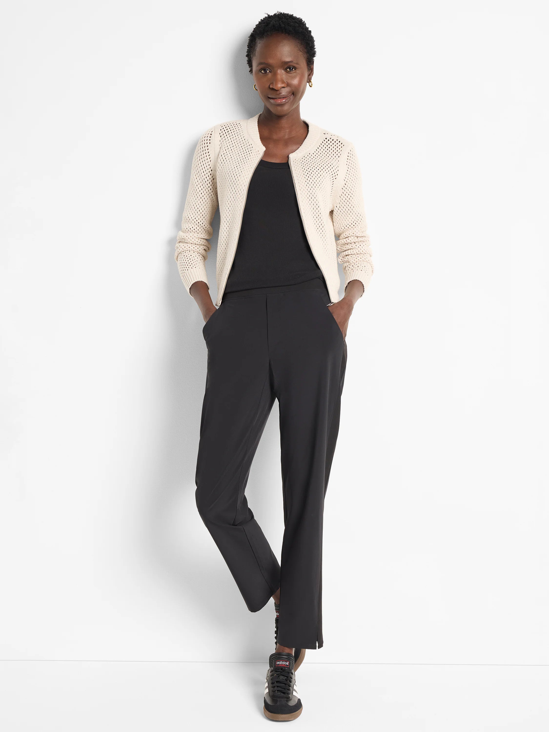 Black straight-leg pants; model wears off-white cardigan.