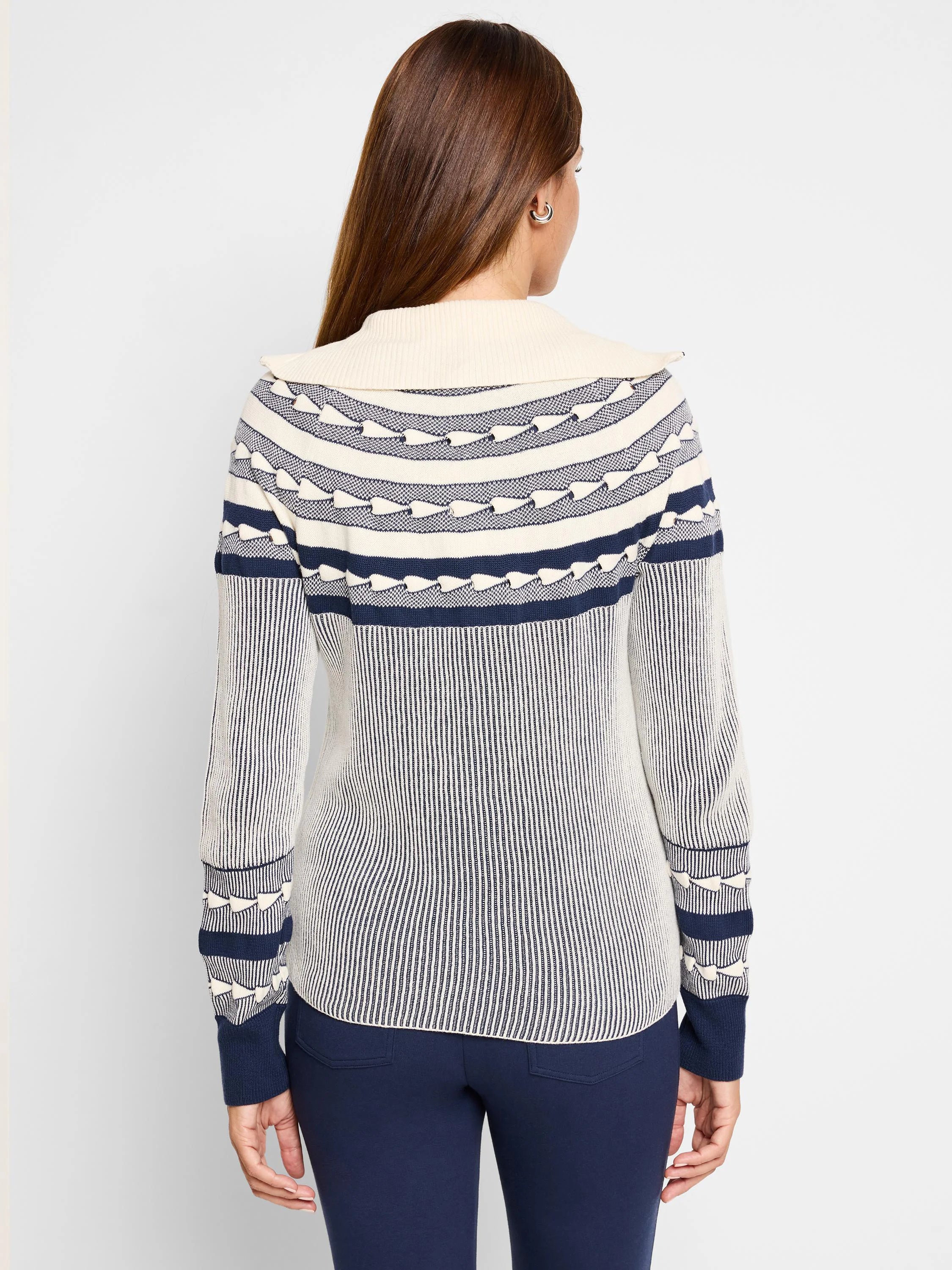 Cream and navy blue Fair Isle zip-front cardigan.  Features horizontal stripes and patterned yoke.  Long sleeves with...