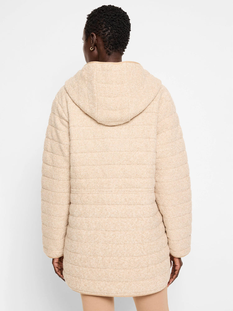 Beige hooded quilted coat. Horizontal quilting, long sleeves. Reverse side not visible.