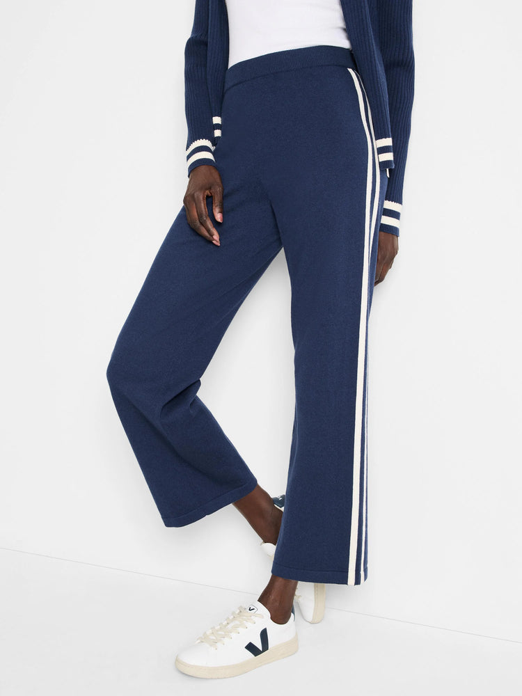 Navy blue wide-leg pants with off-white side stripes.