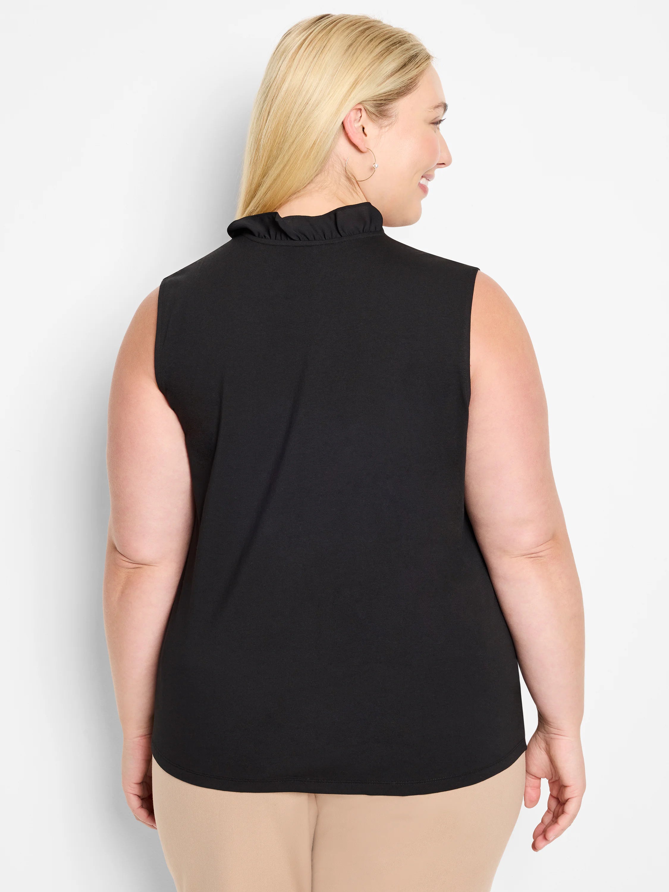 Black sleeveless tank with a ruffled mock neckline.