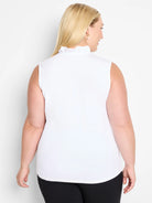 White sleeveless tank top with a ruffled mock neck, shown from the back on a model.