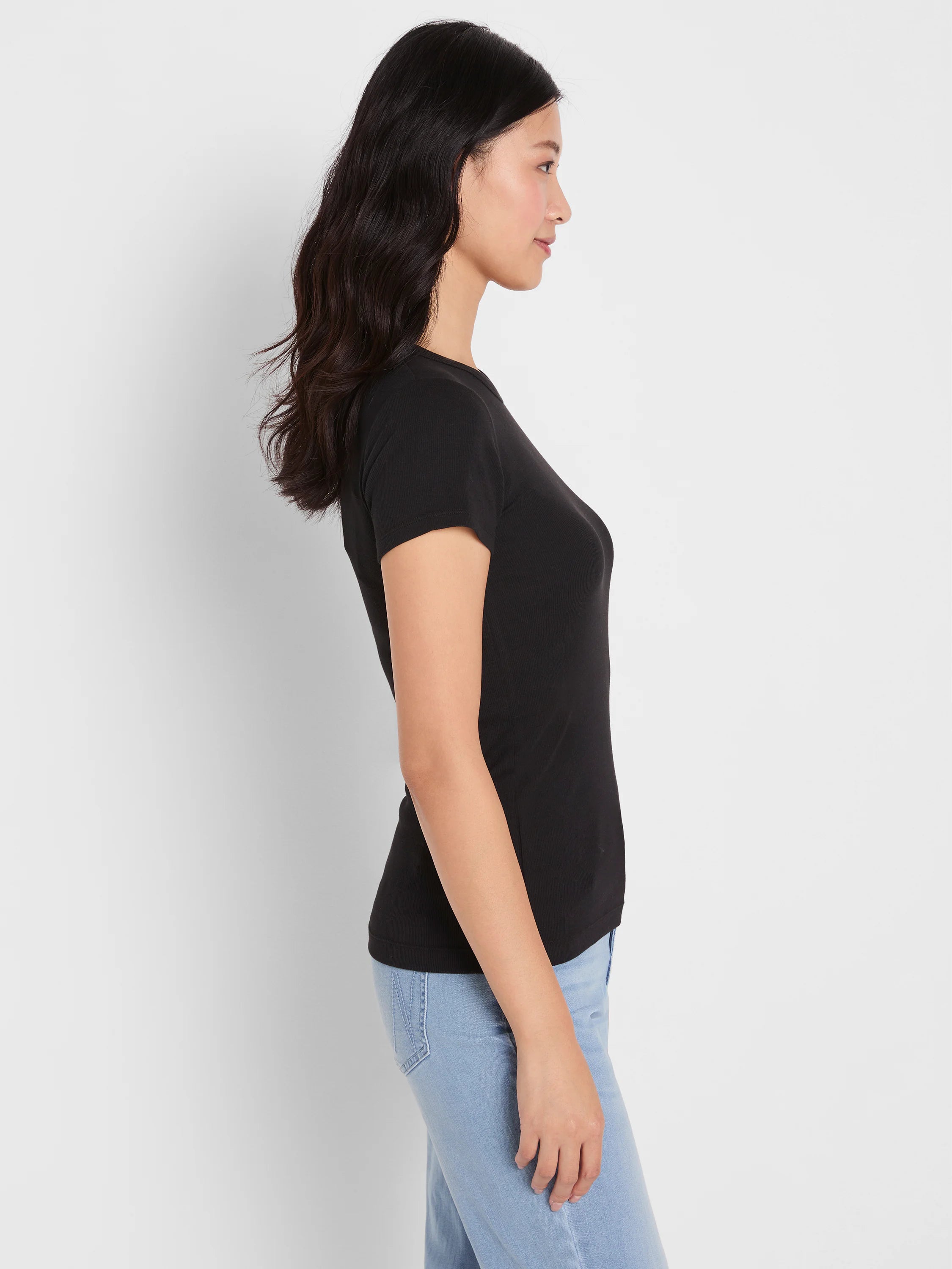 Black rib knit short sleeve crew neck tee, fitted on a model.